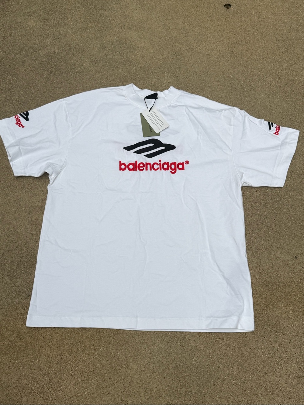 Balenciaga White Tee with Black Emblem and Red Logo